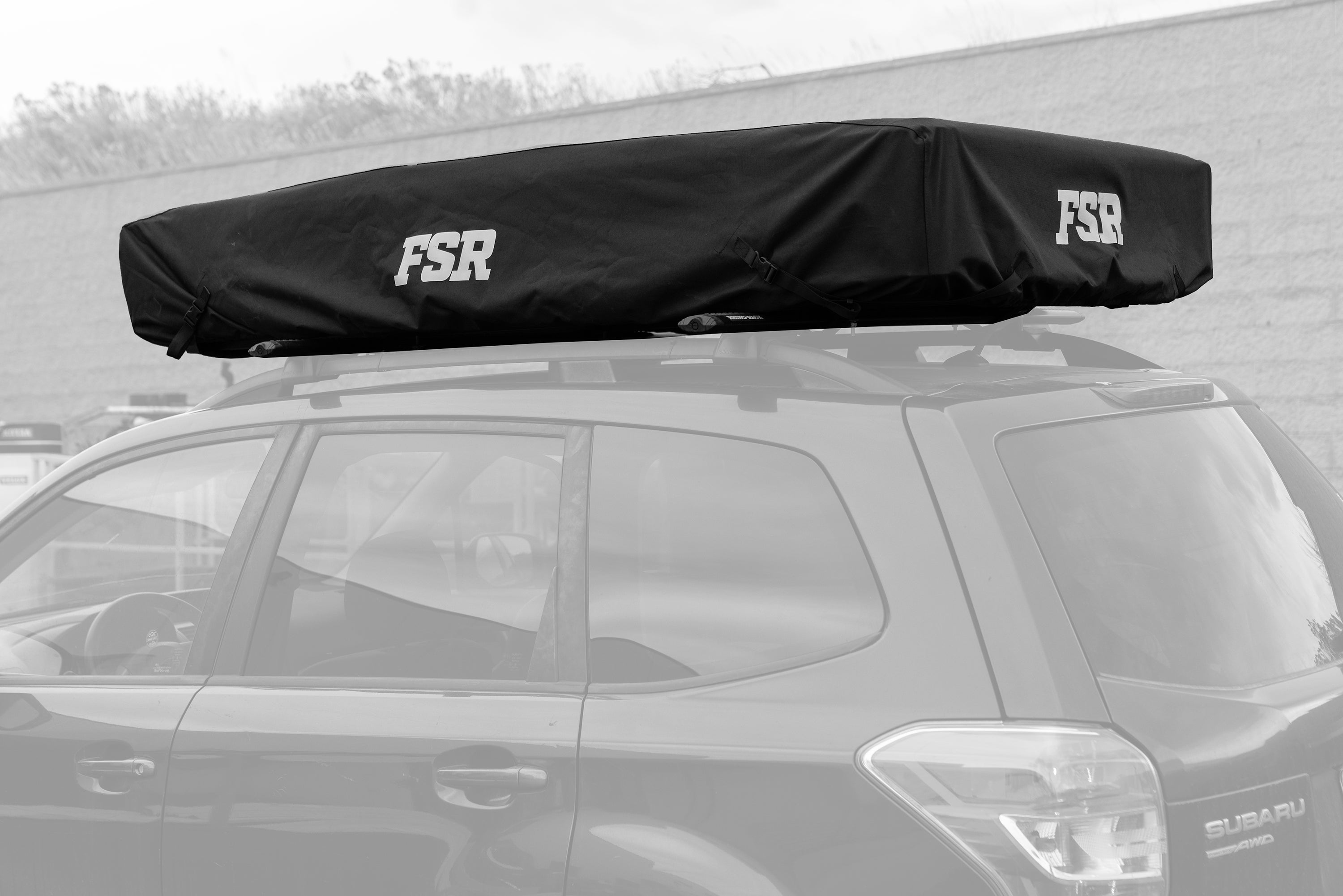 Black roof rack cover with 'FSR' branding on a vehicle