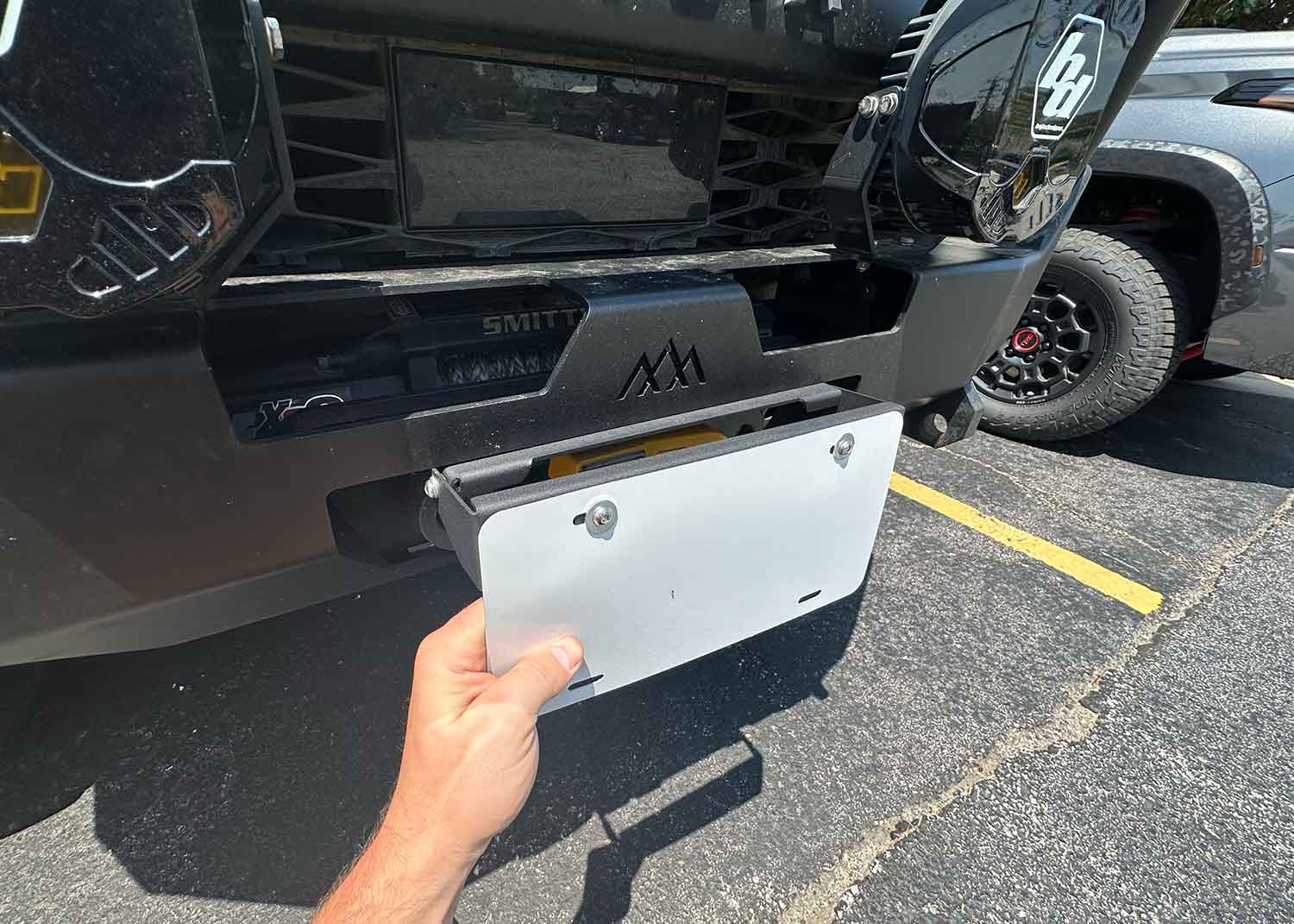 Flip Up Front License Plate Holder - Hawse Fairlead - Spirit of 1876 - Backwoods Adventure Mods