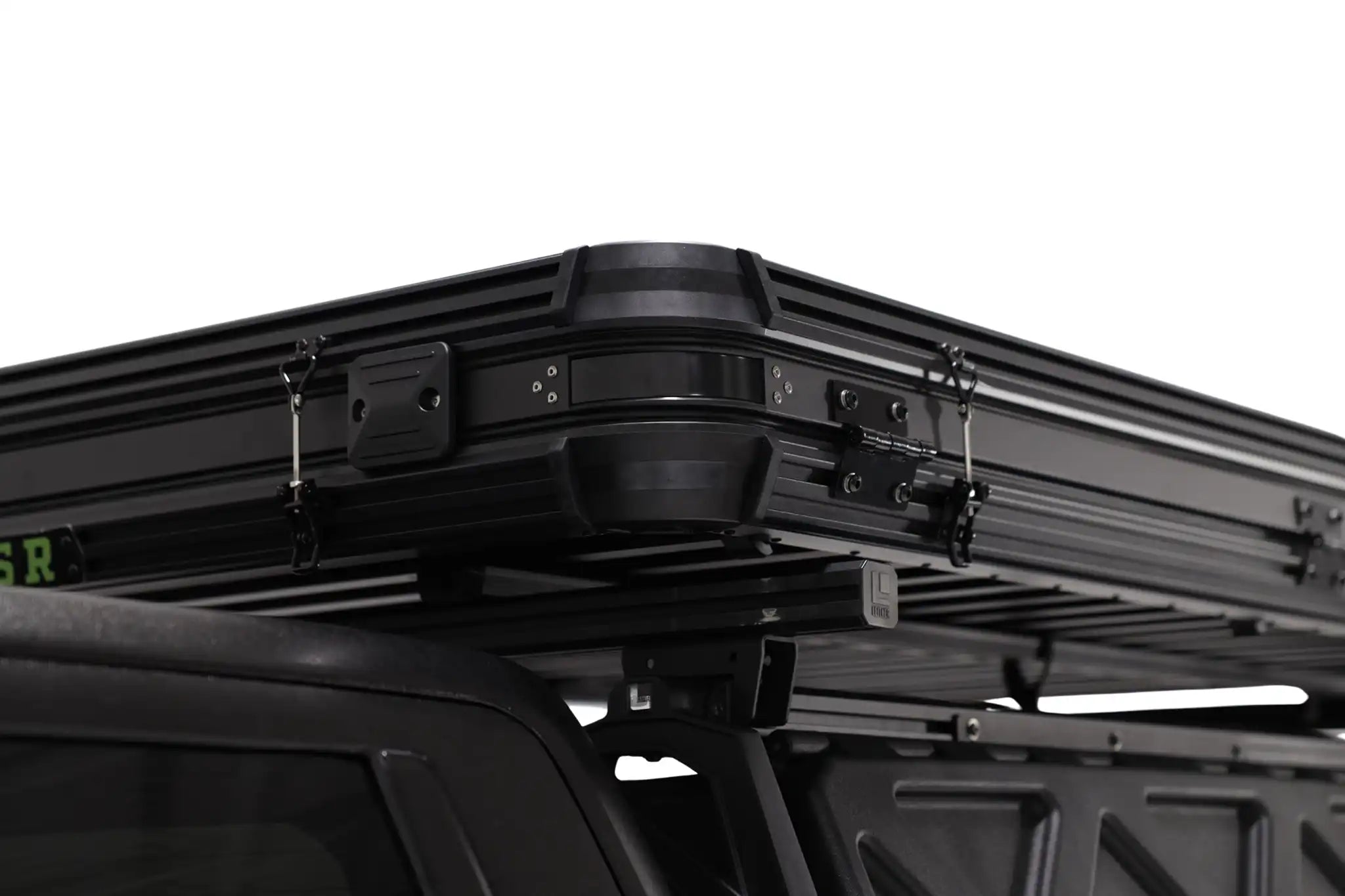 Black car roof rack system on a vehicle with a white background