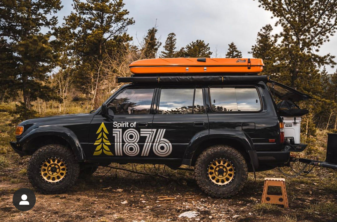 James Baroud orange tent on a toyota land cruiser