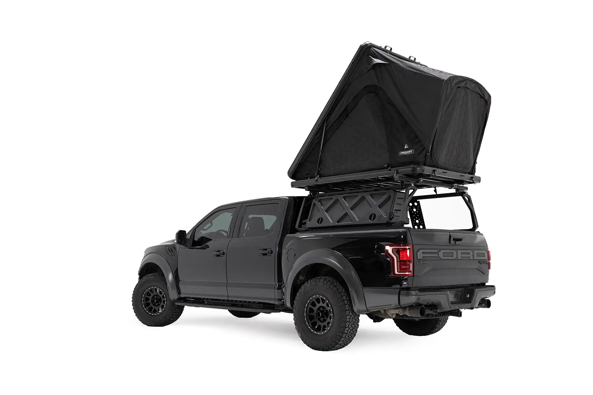 Black truck with an open rooftop storage container on a white background