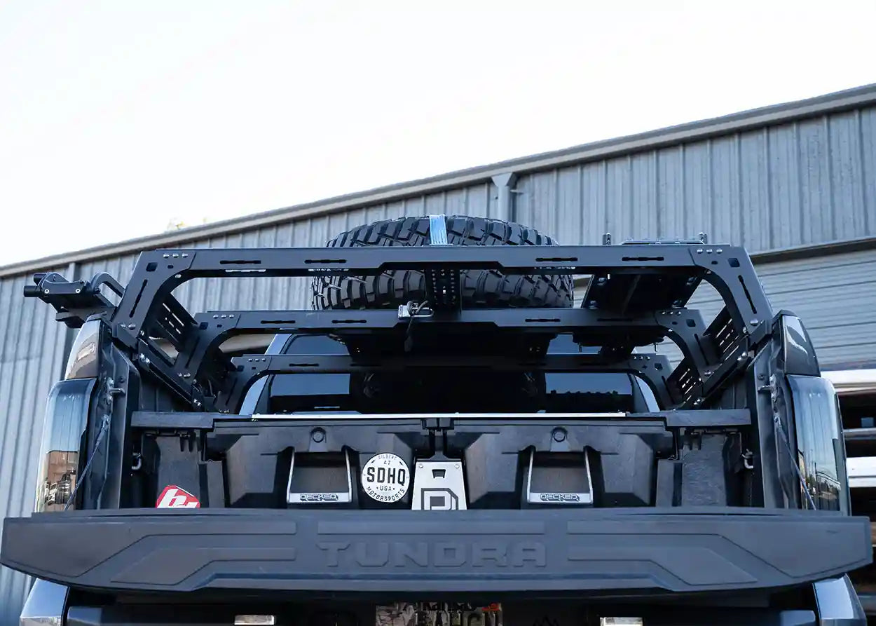 Truck bed with storage rack and spare tire on a Toyota Tundra truck