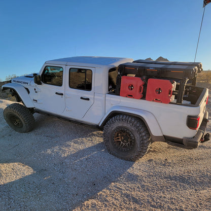 Jeep Gladiator Rubicon with XTR1 Bed Rack, RotoPax, Vault cases, and traction boards. 