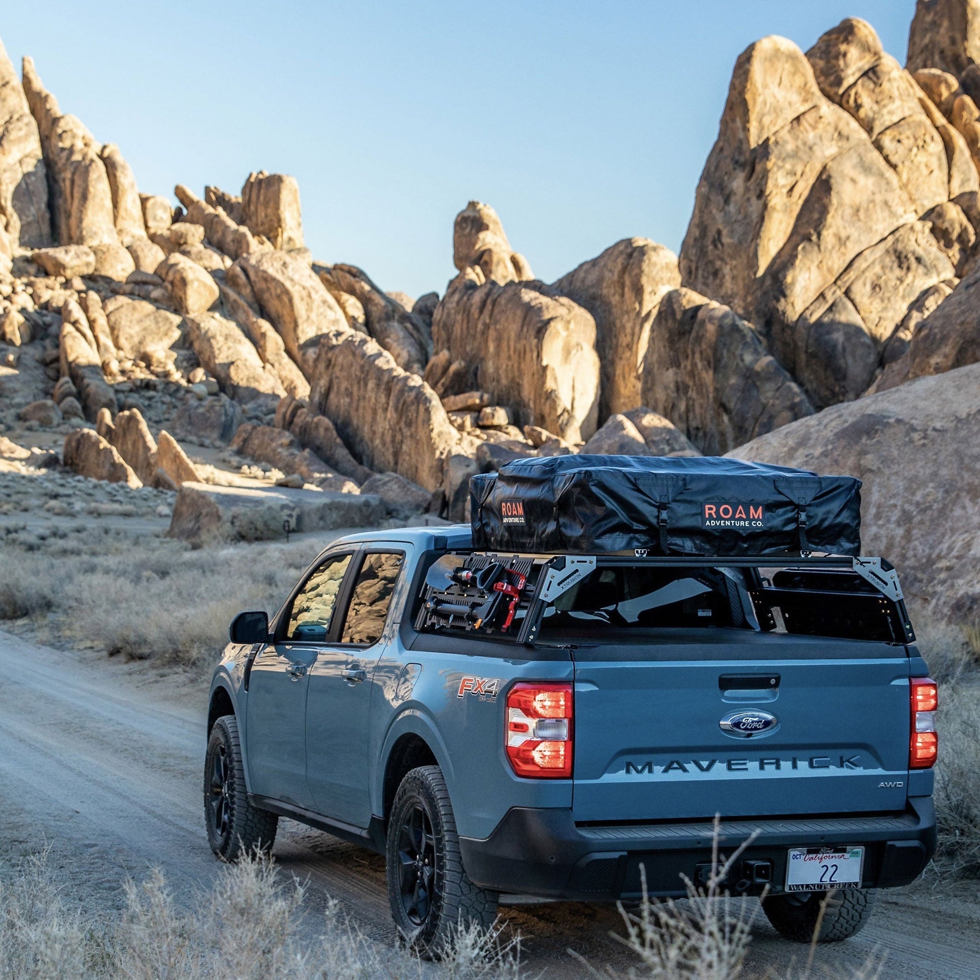 Ford Maverick FX4 with extrusion overland bed rack loaded with RTT, Shovel, ax, molle panels