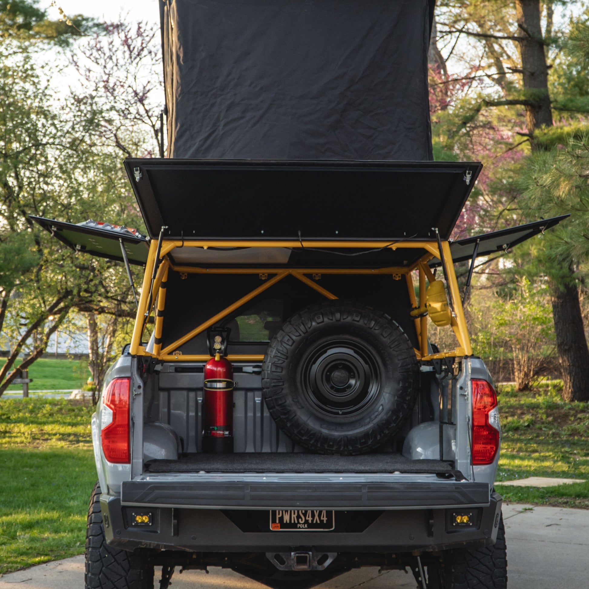 Spare tire carrier for tacoma or tundra in bed of truck